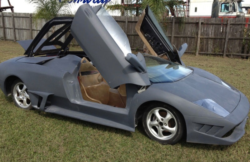 Porsche Boxster turned into a Lamborghini Murcielago LP640 Roadster Doors Up