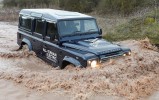 2013 Land Rover Defender Electric Concept Front 7-8 Right Fording a Creek